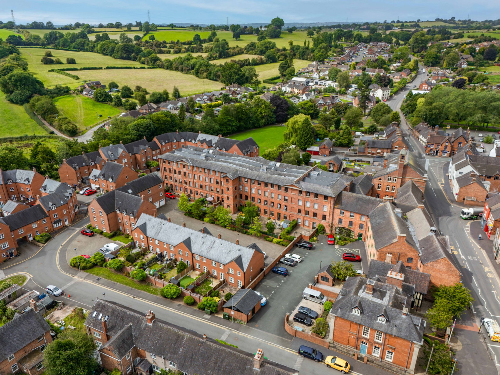 Aerial view of the converted mill at Tean Hall Mills and the surrounding countryside